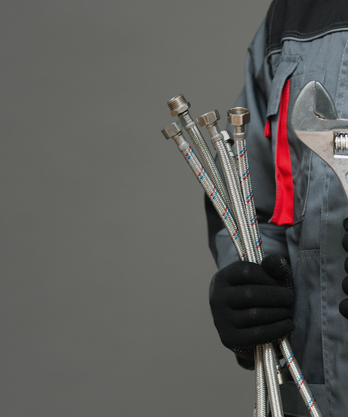 plumber holding tools